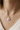 Paw print ashes necklace worn around neck