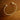 Gold torque bangle on wood background