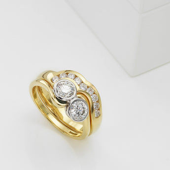 Channel set shaped diamond wedding ring in yellow gold