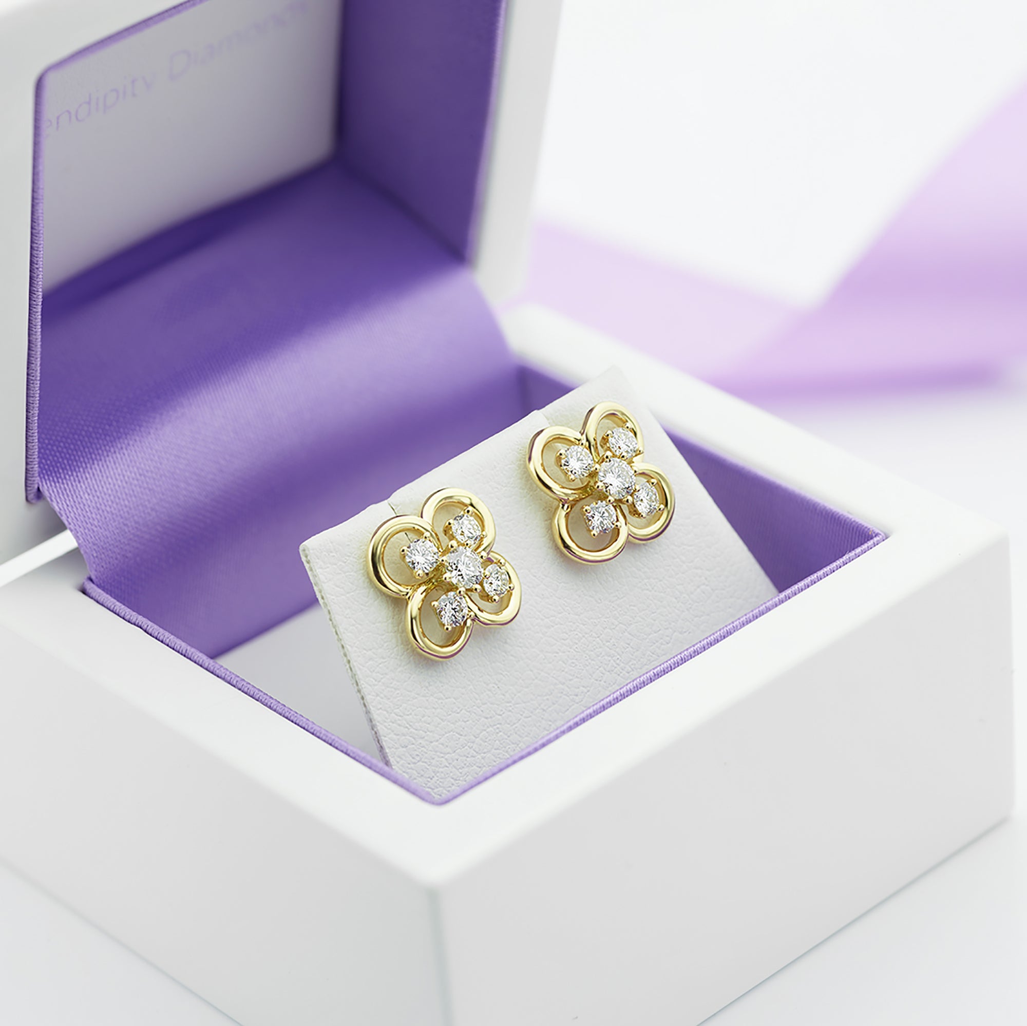 Blossom 5 stone diamond earrings in their box