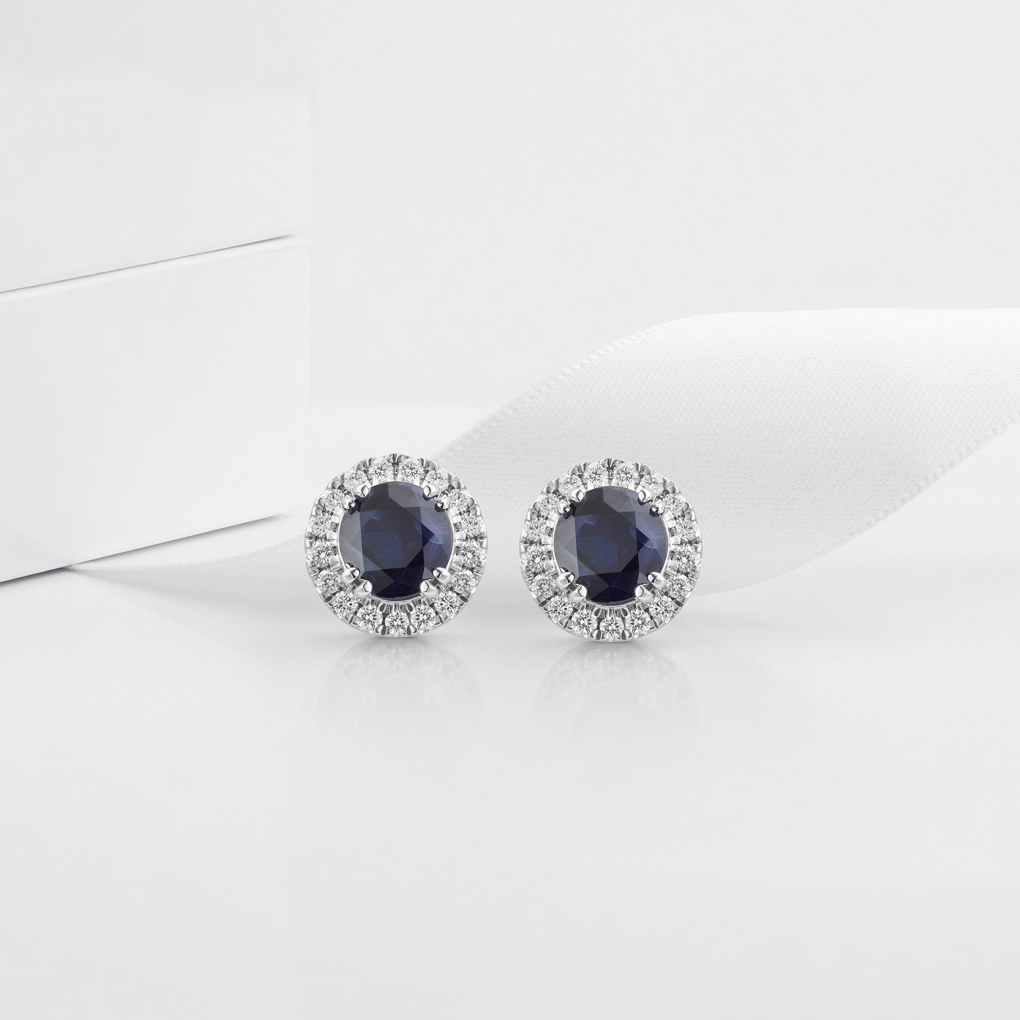 Blue sapphire and diamond halo stud earrings
