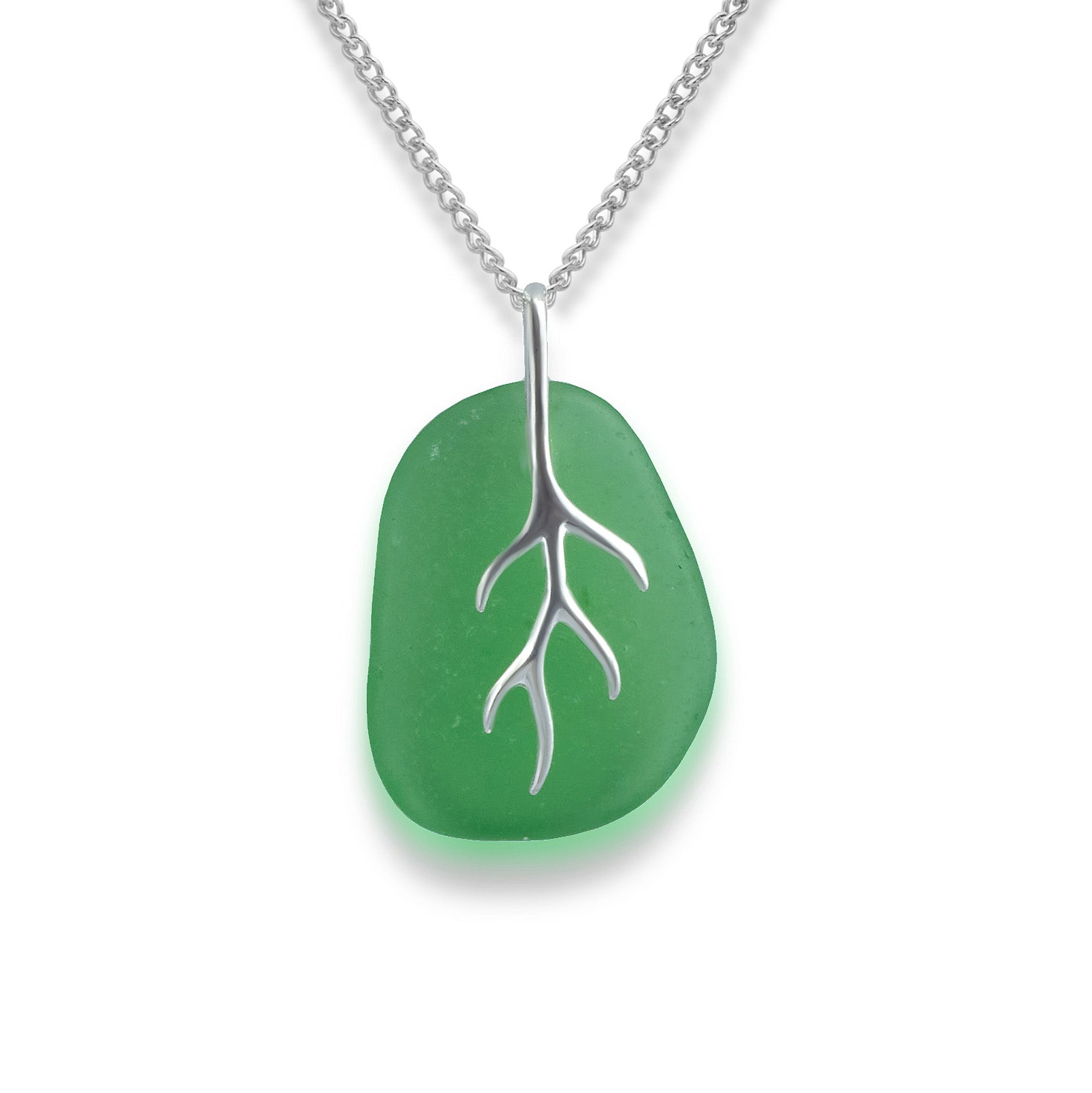 Closeup view of the silver coral effect green sea glass necklace