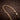 24.5 Inch 9ct Yellow Gold Flat Curb Chain on Wood Background