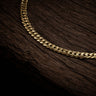 Close up view of 22 inch 9ct yellow gold close link curb chain.