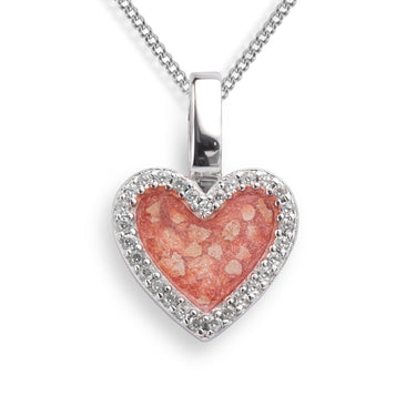 Heart shaped halo ashes necklace shown in close up view with blush resin and ashes filling