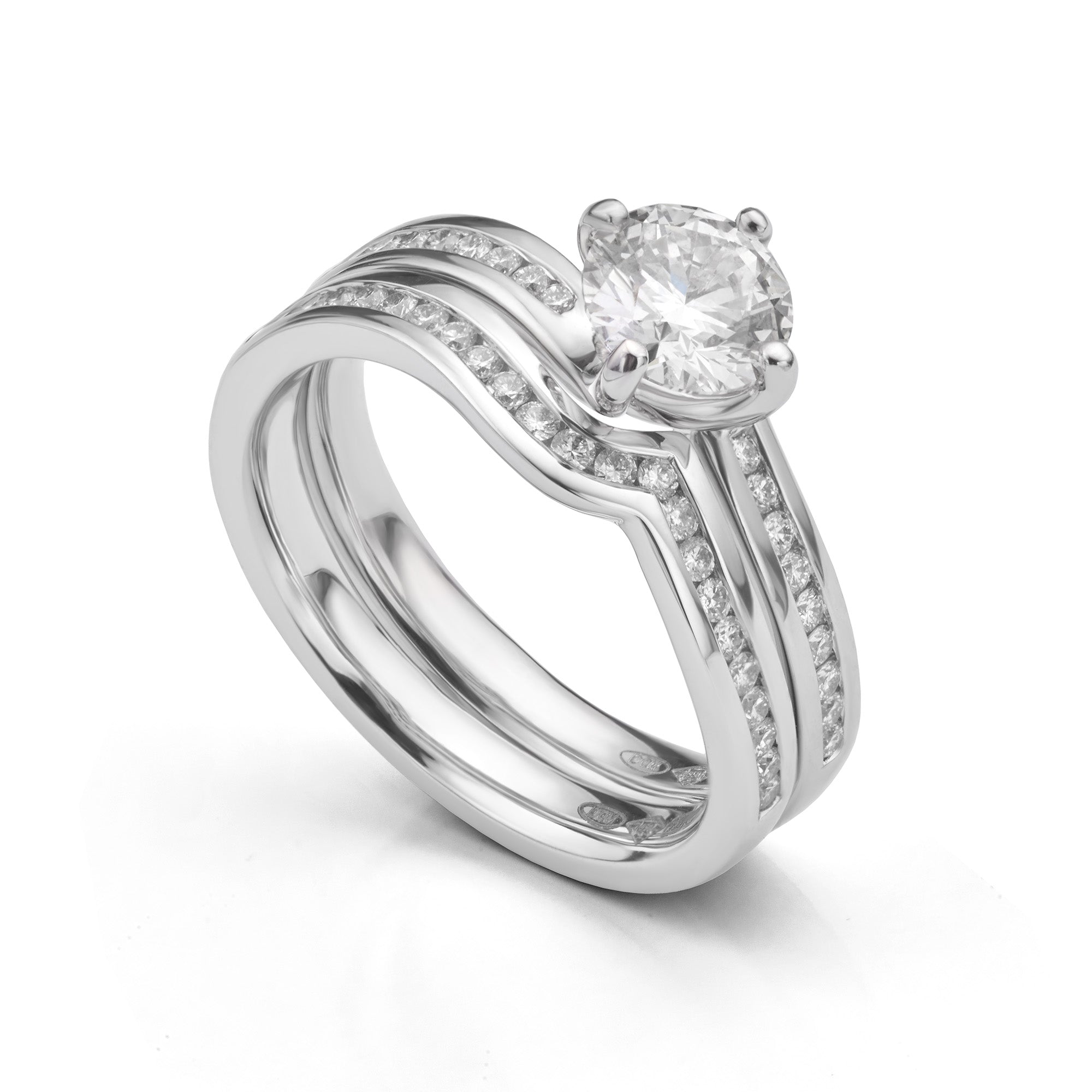 Twist diamond ring set showing twist engagement ring and diamond shaped wedding ring