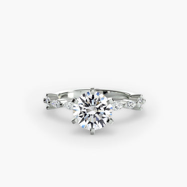 Vellana round diamond solitaire engagement ring front facing view, with marquise and round diamond shoulders in white gold or platinum. 