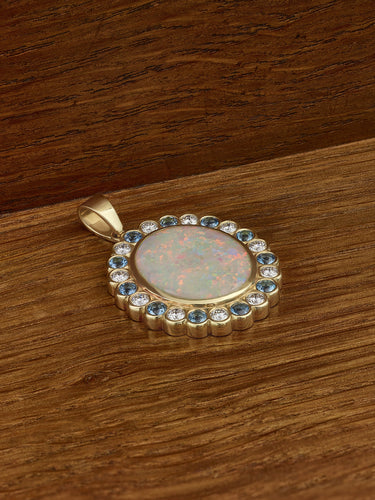 Remodelled ring now transformed into an Opal necklace with surrounding halo.