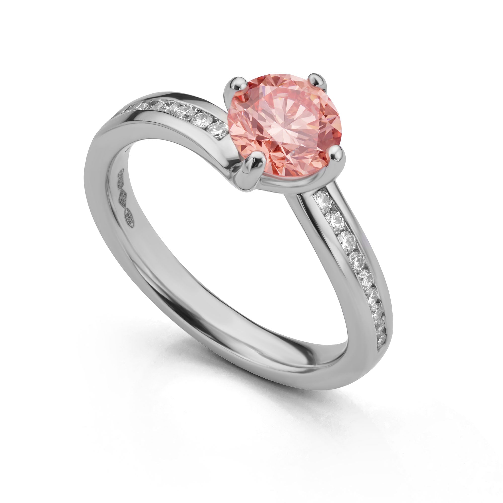 Pink diamond engagement ring on white background
