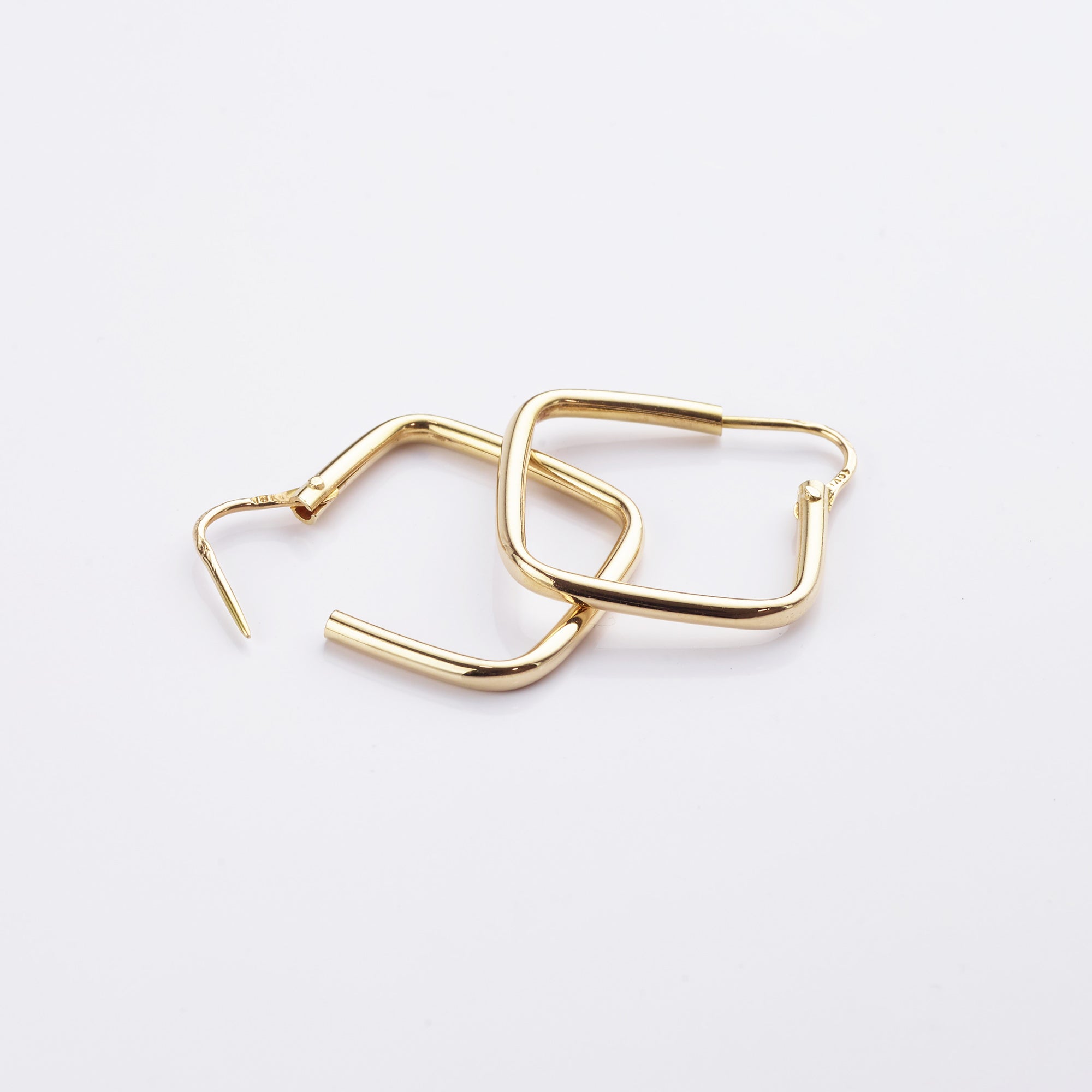 Detailed view of the pre-loved gold squared hoop earrings