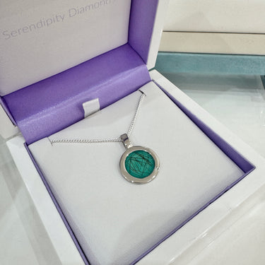 Boxed view of the RL007 hair set Silver pendant in presentation box