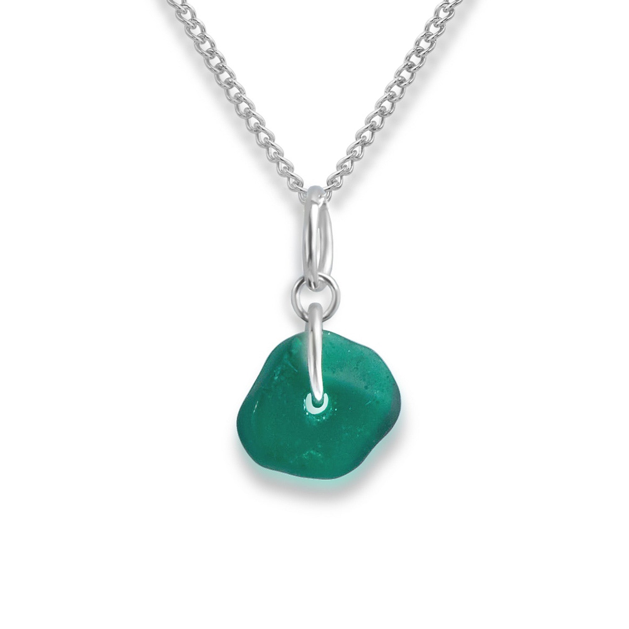 Close up view of the teal sea glass charm necklace