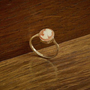 Vintage 9ct Yellow Gold Cameo Ring – 1966 – Size L on wood background