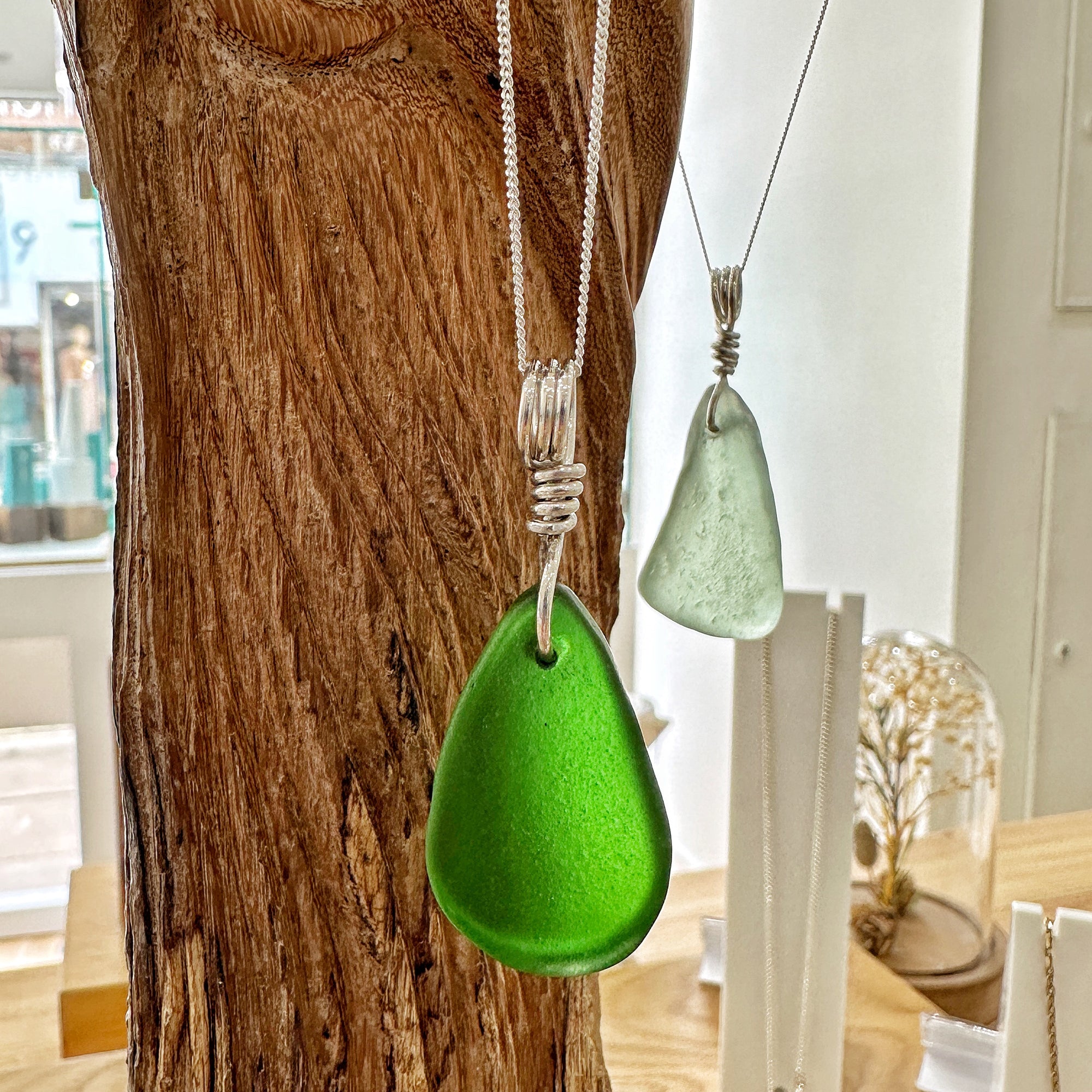 View of the green sea glass necklace in the Serendipity Diamonds showroom