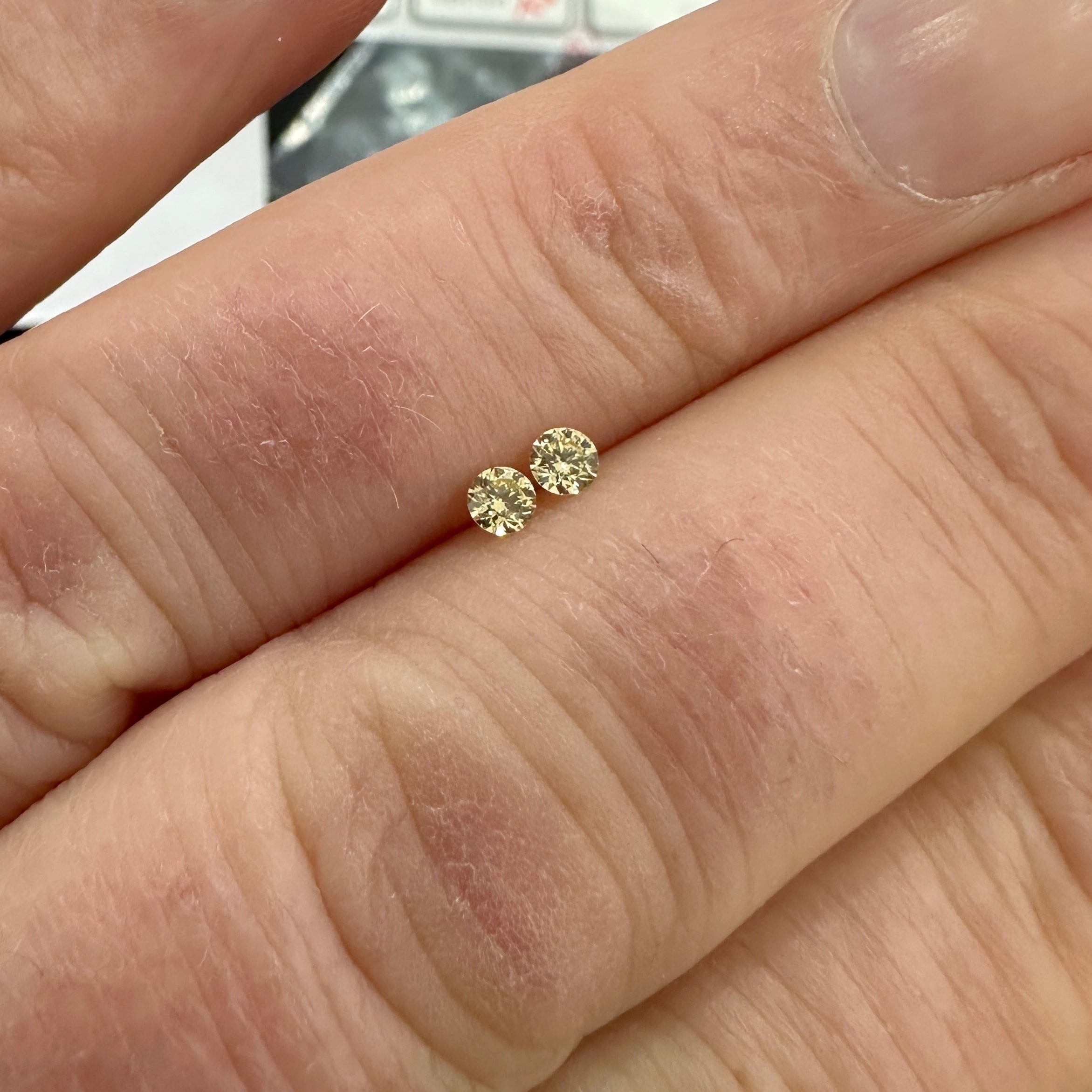 Light yellow diamonds shown on the fingers