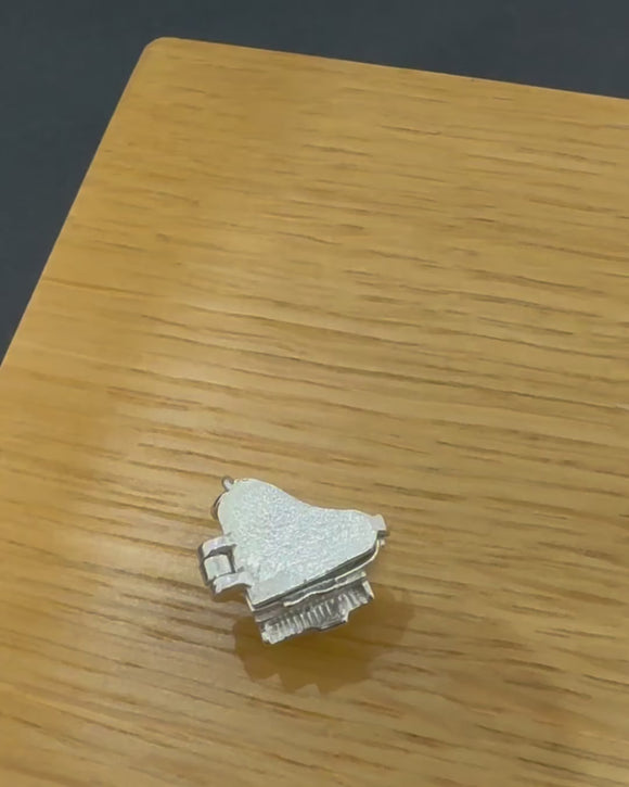 Silver hinged piano shown in video opening