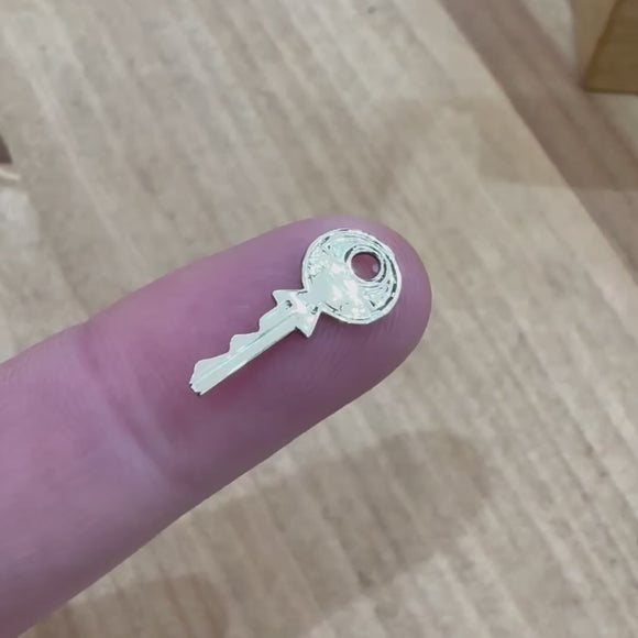 Mini yale gold key charm